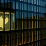 Birmingham cityscape at dusk with office windows representing website analysis